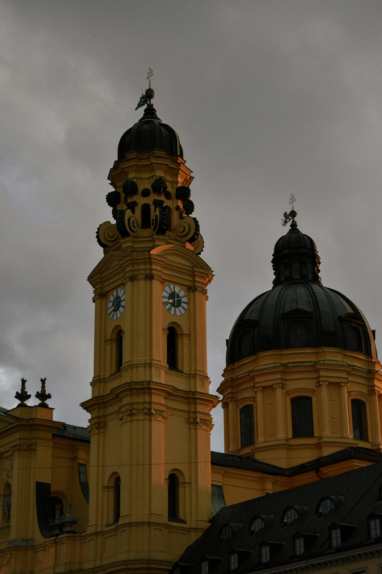 the large clock is on top of a very tall building