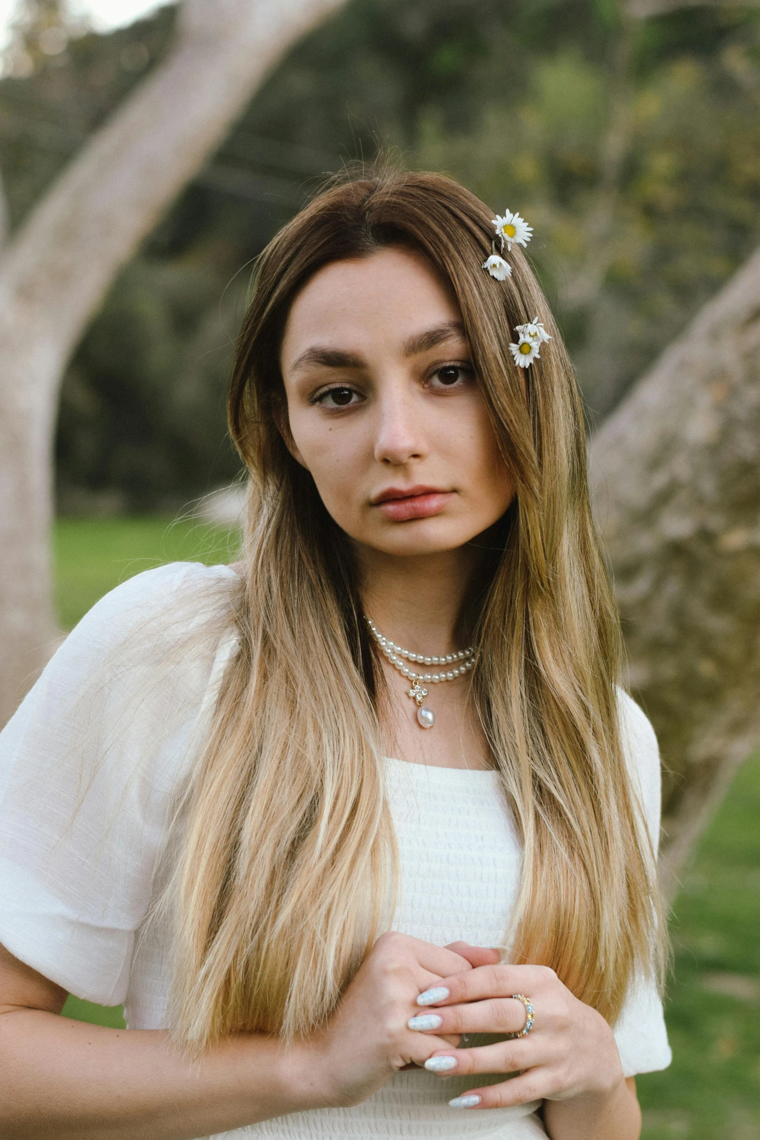 a girl with long hair wearing a flower in her hair