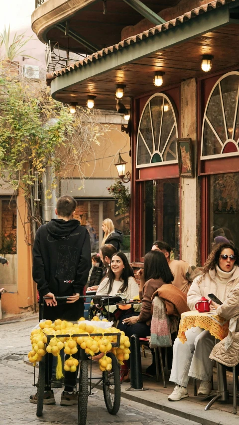 people sit around in front of the restaurant