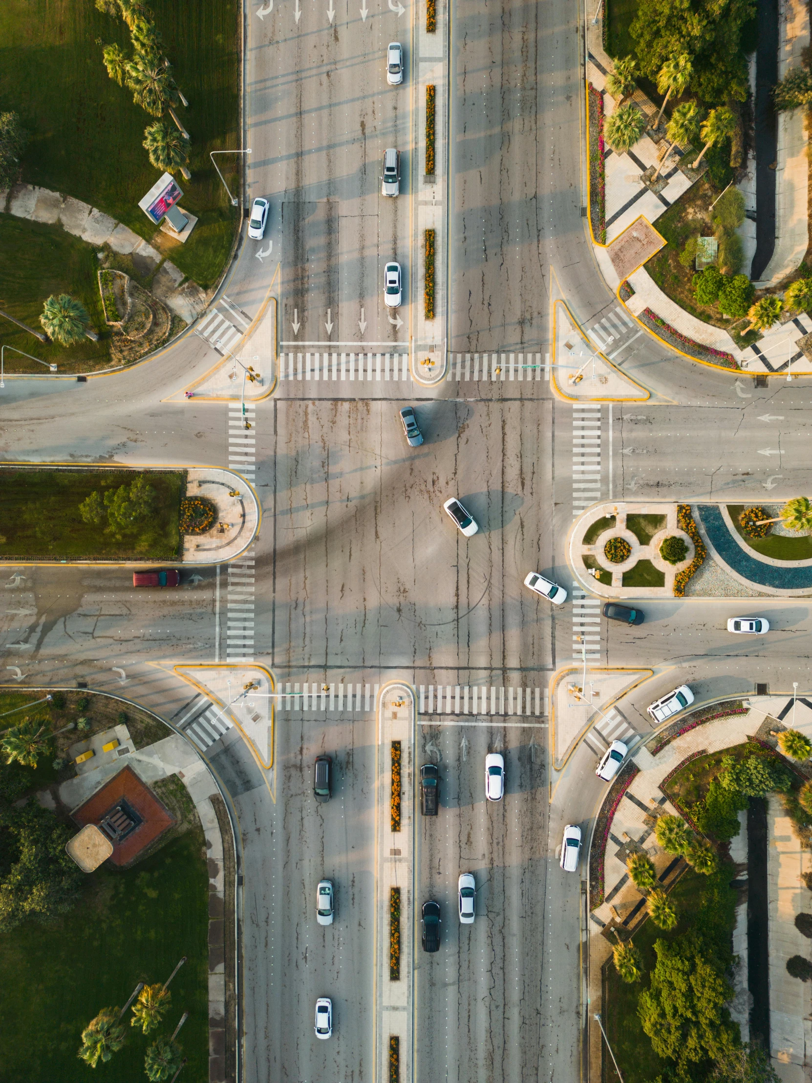 a city intersection with cars parked on top of it