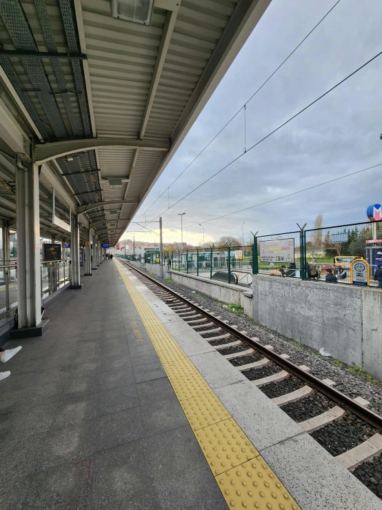 the platform is empty with passengers waiting for their train