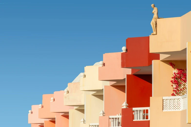 a row of brightly colored buildings under a blue sky