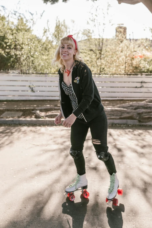 a woman with blonde hair is on a skateboard