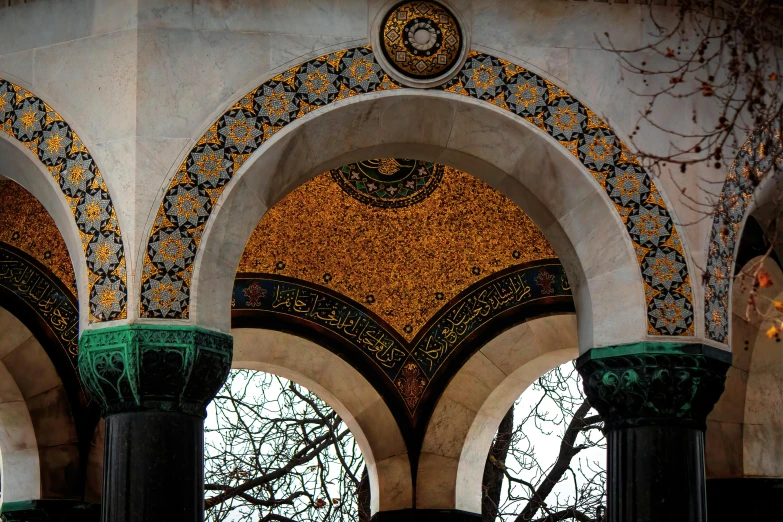 a building with arched walls and pillars filled with lights