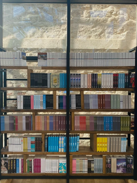 a long book case sitting on top of a wood floor