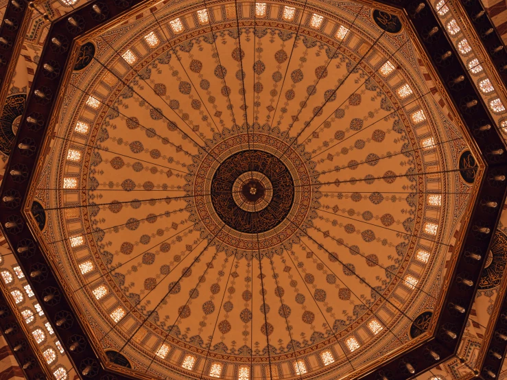 a very large pretty decorative ceiling in a building