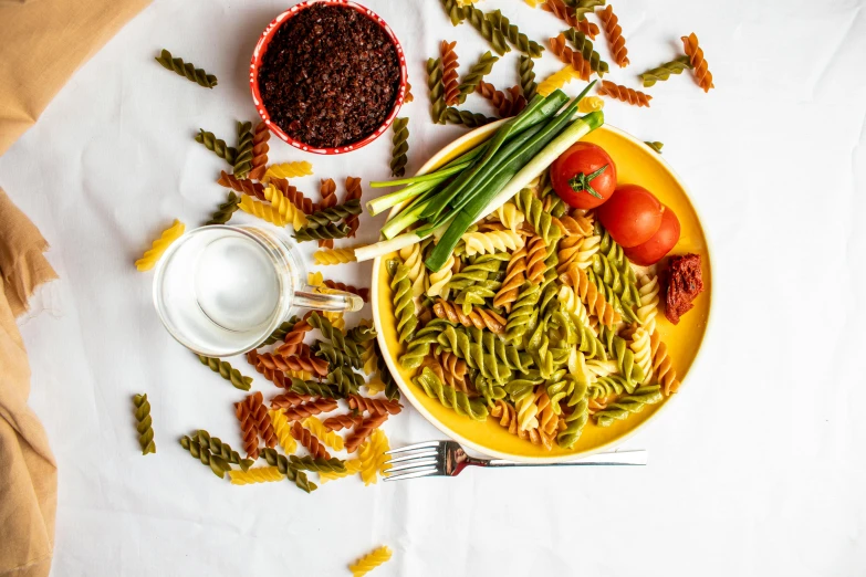 some green beans and tomatoes are on the plate with the ingredients