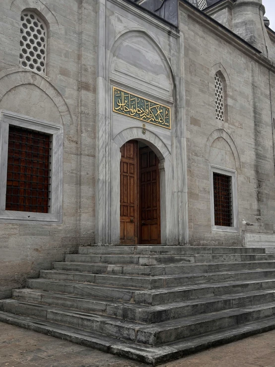 large entrance in side wall of building with stone steps