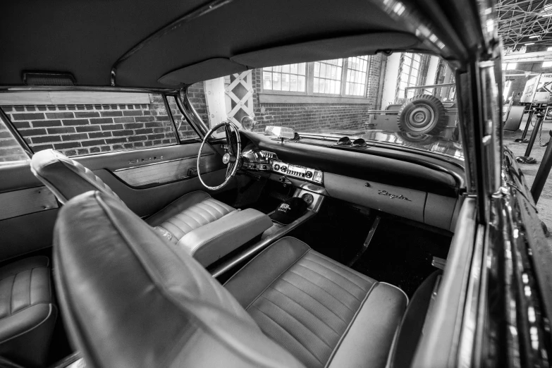 an old, classic looking car with leather seat covers