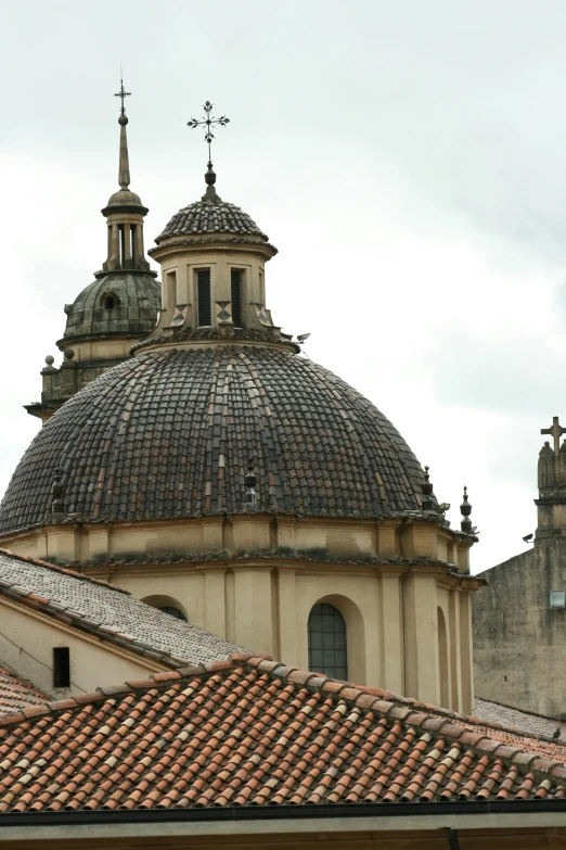 an ornate building with three steeples and a cupola