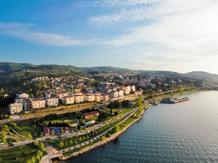 an aerial po of a town near the water