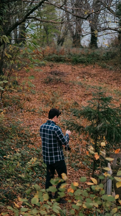 a man standing on top of a patch of grass