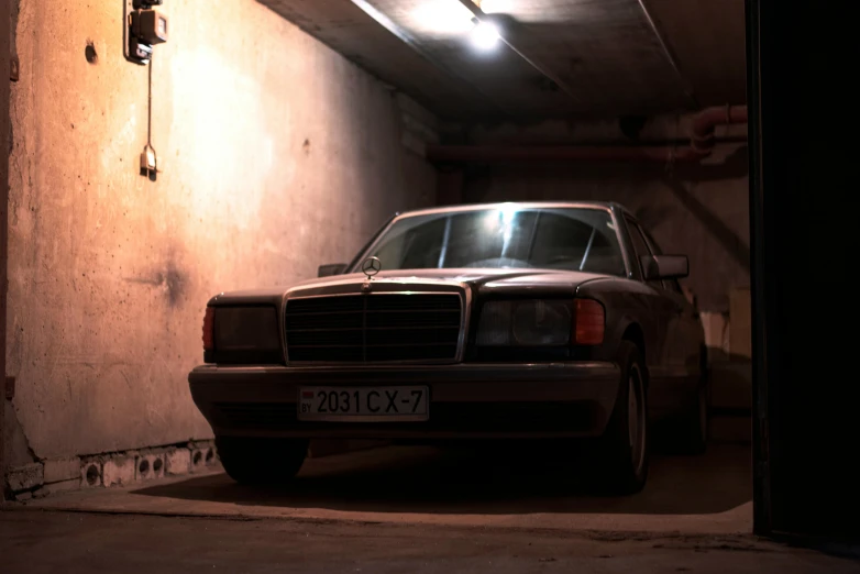 a parked car is lit up and dark with a light on