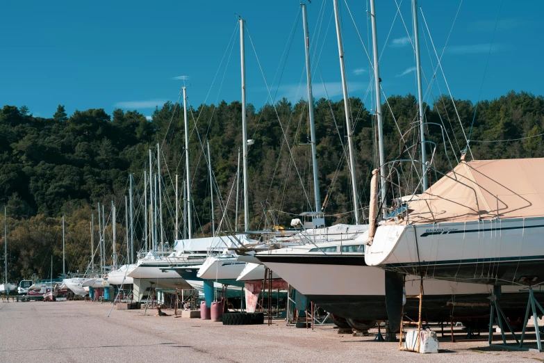 a group of boats sitting next to each other on a lake