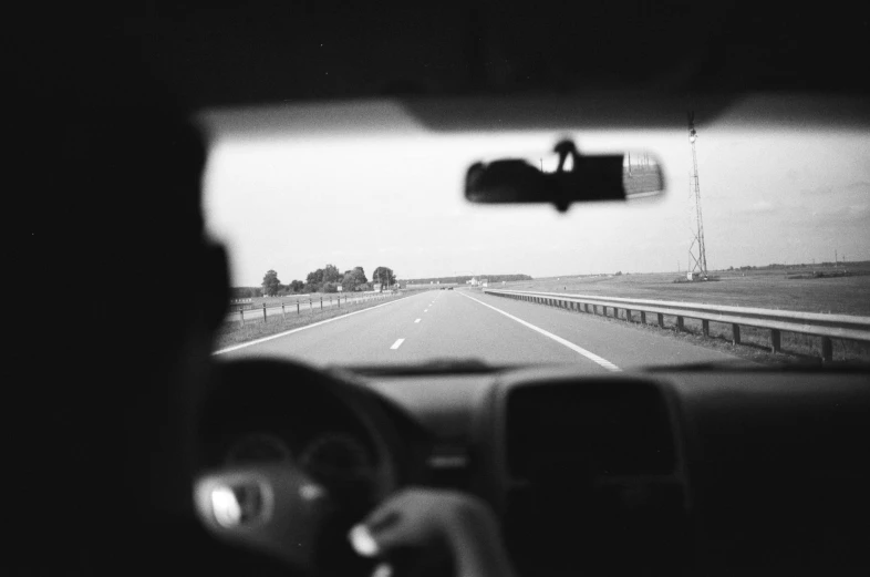 view from a vehicle driving down the road to the horizon