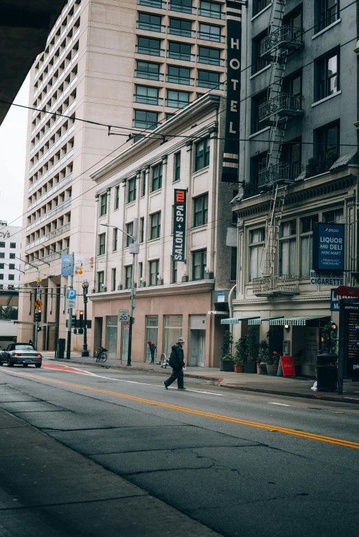 people are walking and riding bicycles in front of the building