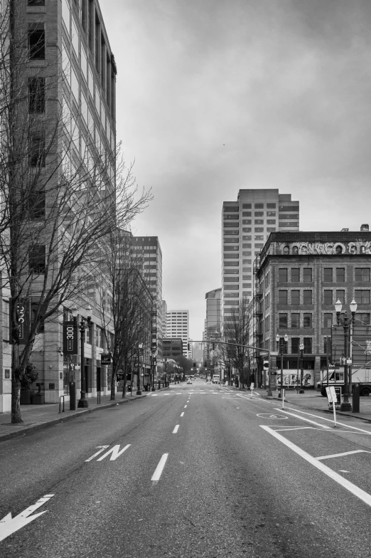 the empty city street with tall buildings