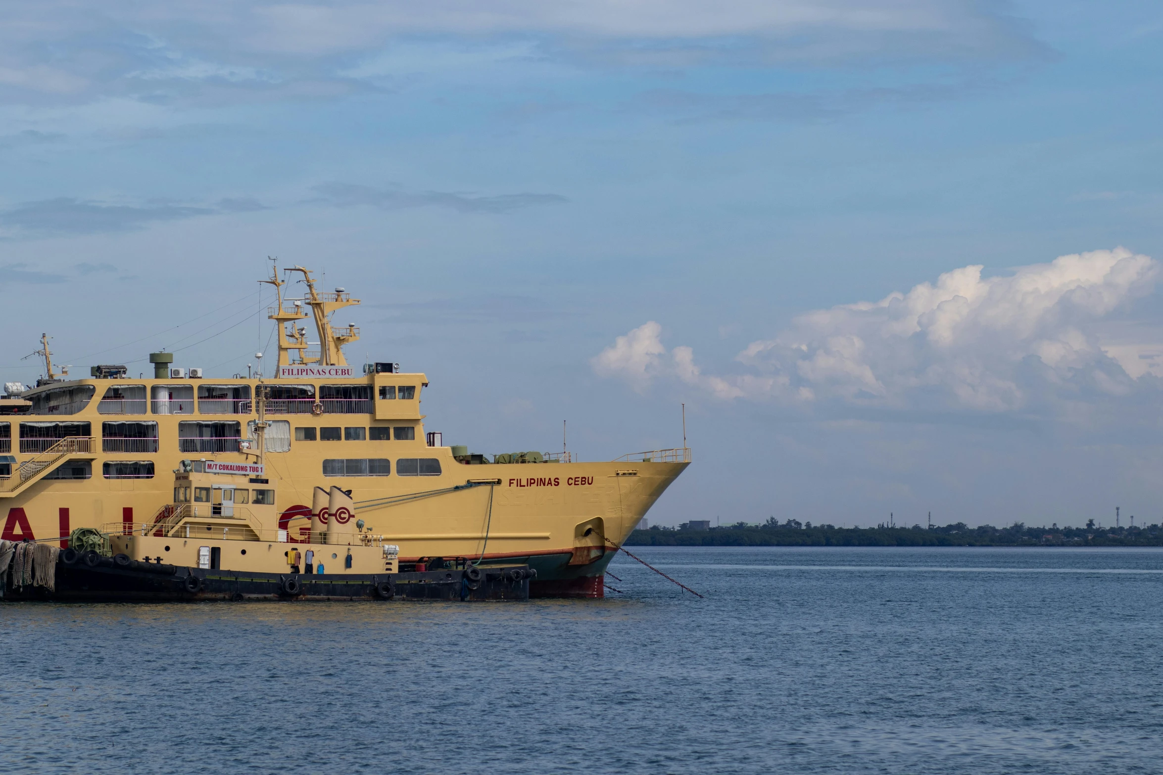 two yellow boats that are floating in the water