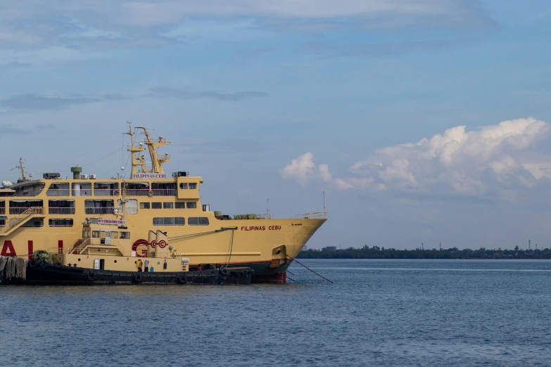 two yellow boats that are floating in the water