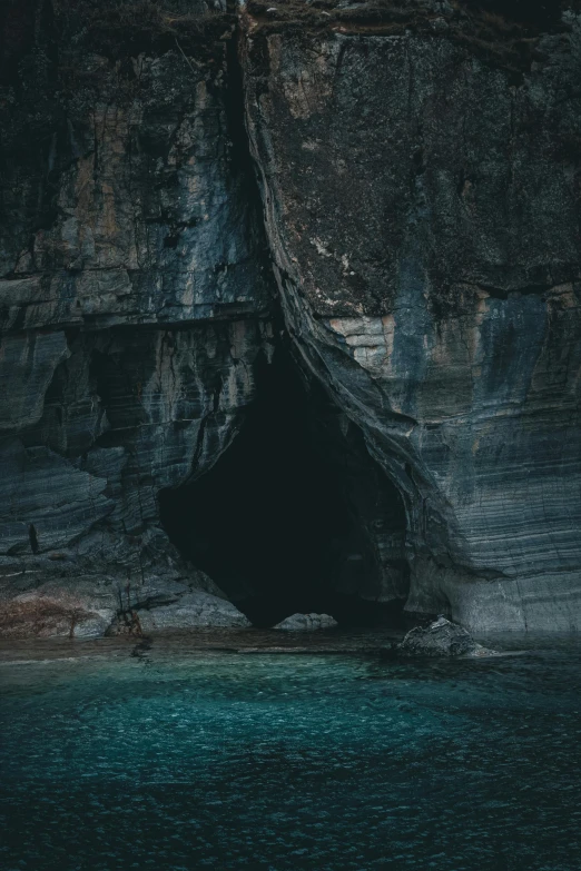 a cave on the edge of a large cliff