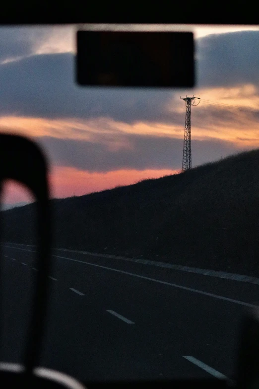 there are two hills, and a telephone tower are shown