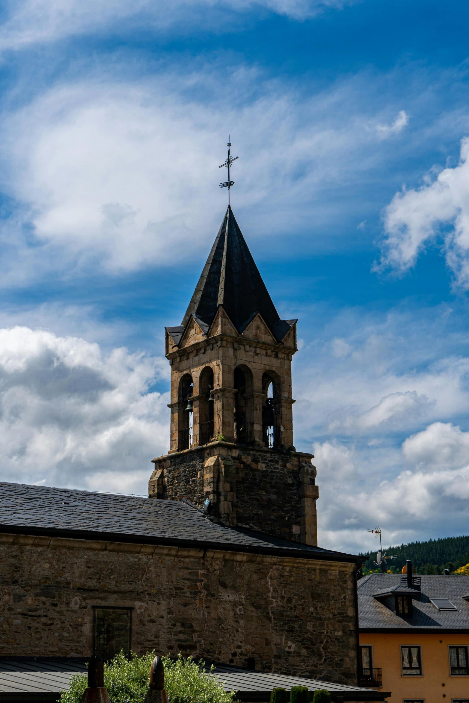 an old, stone building has a spire on top of it