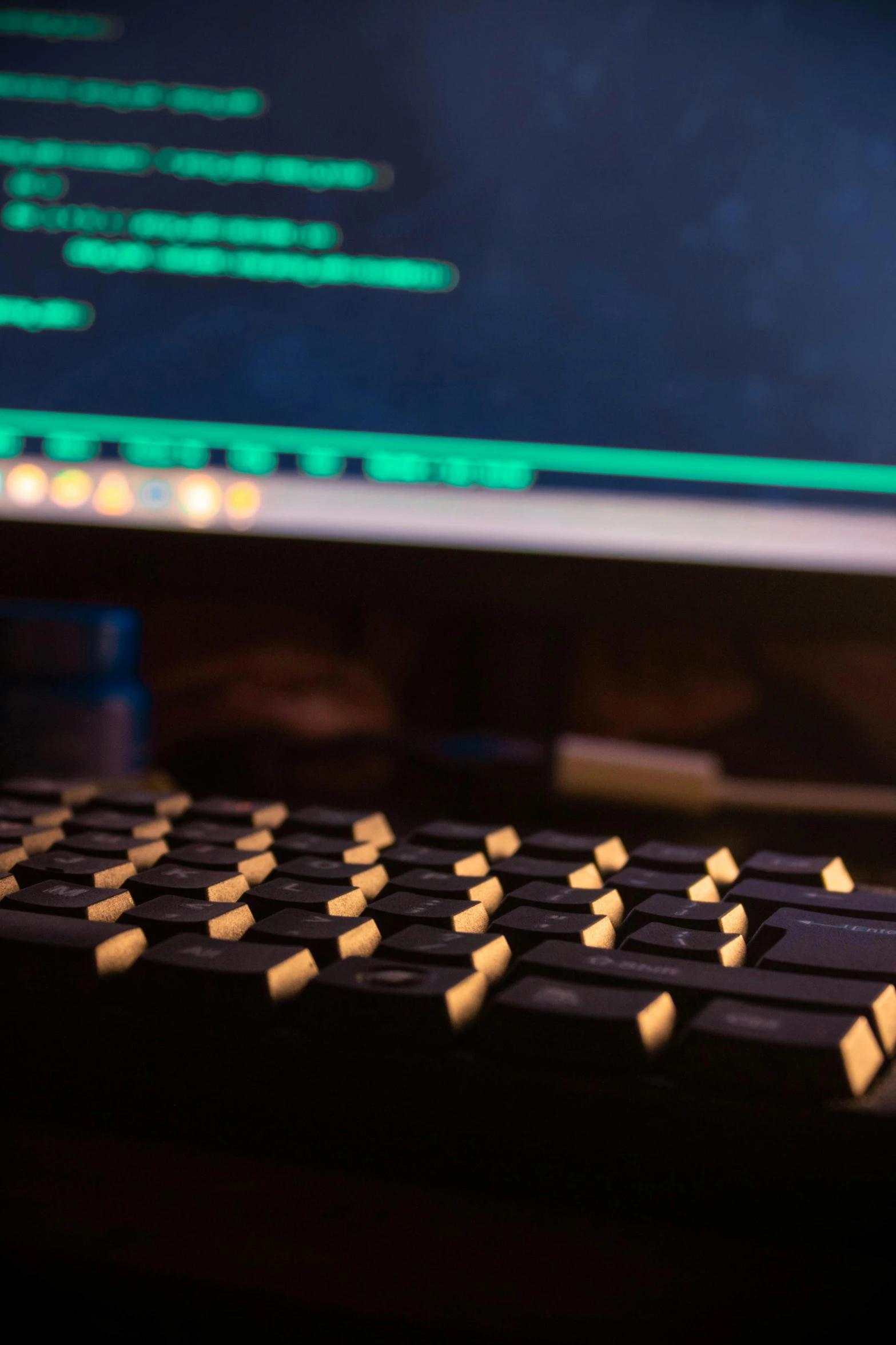 a closeup of a keyboard and a monitor