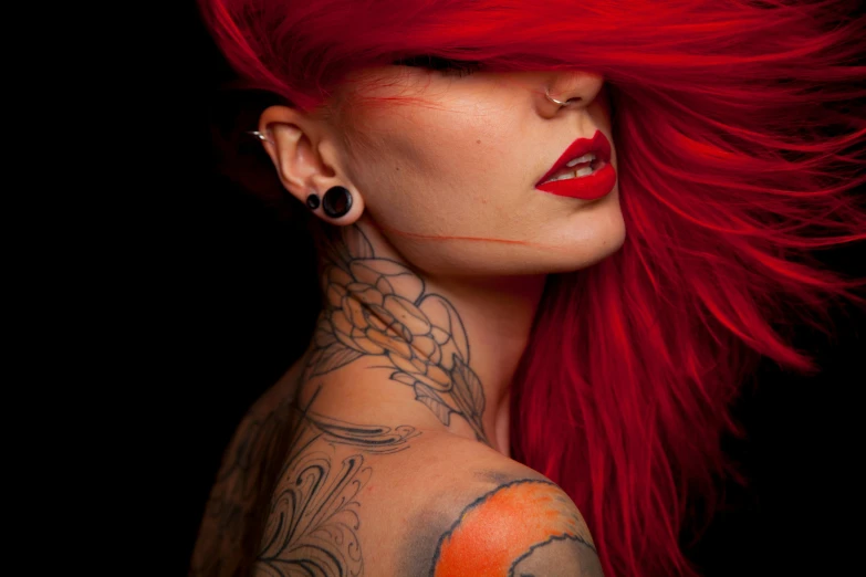 a woman with red hair and tattoos