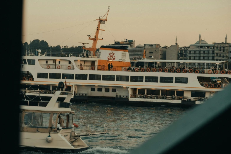 a large white boat full of people in the water