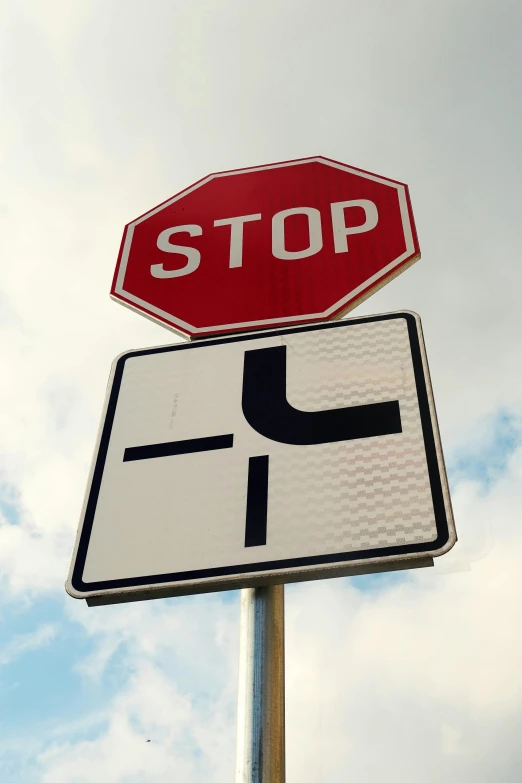 a stop sign and street sign giving information