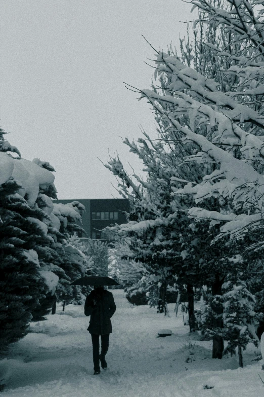 a man that is walking down a sidewalk