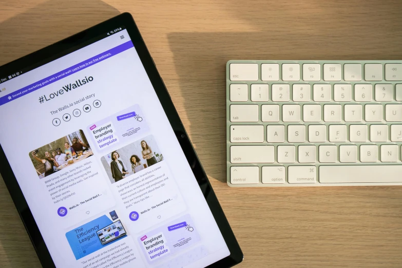 a tablet with a web page on top and an electronic keyboard