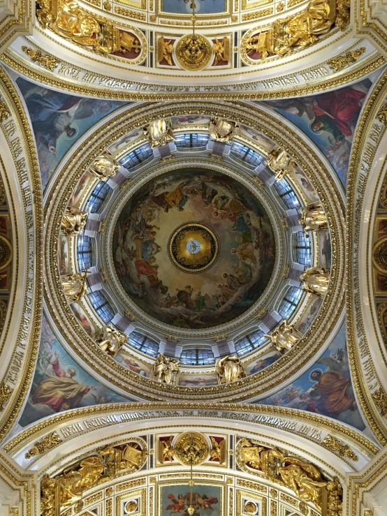 intricate painting on the ceiling above the pew