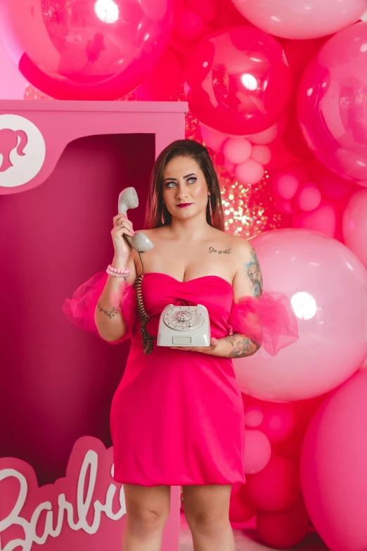 a woman in a red dress holding a cell phone