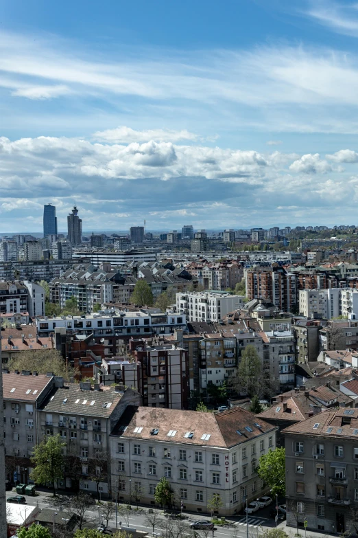 an urban skyline, with tall buildings, and lots of trees