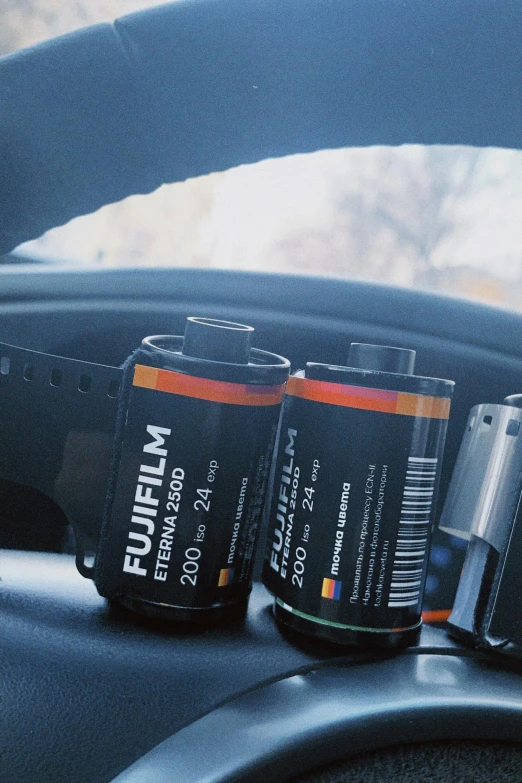 two batteries are sitting in a car dashboard
