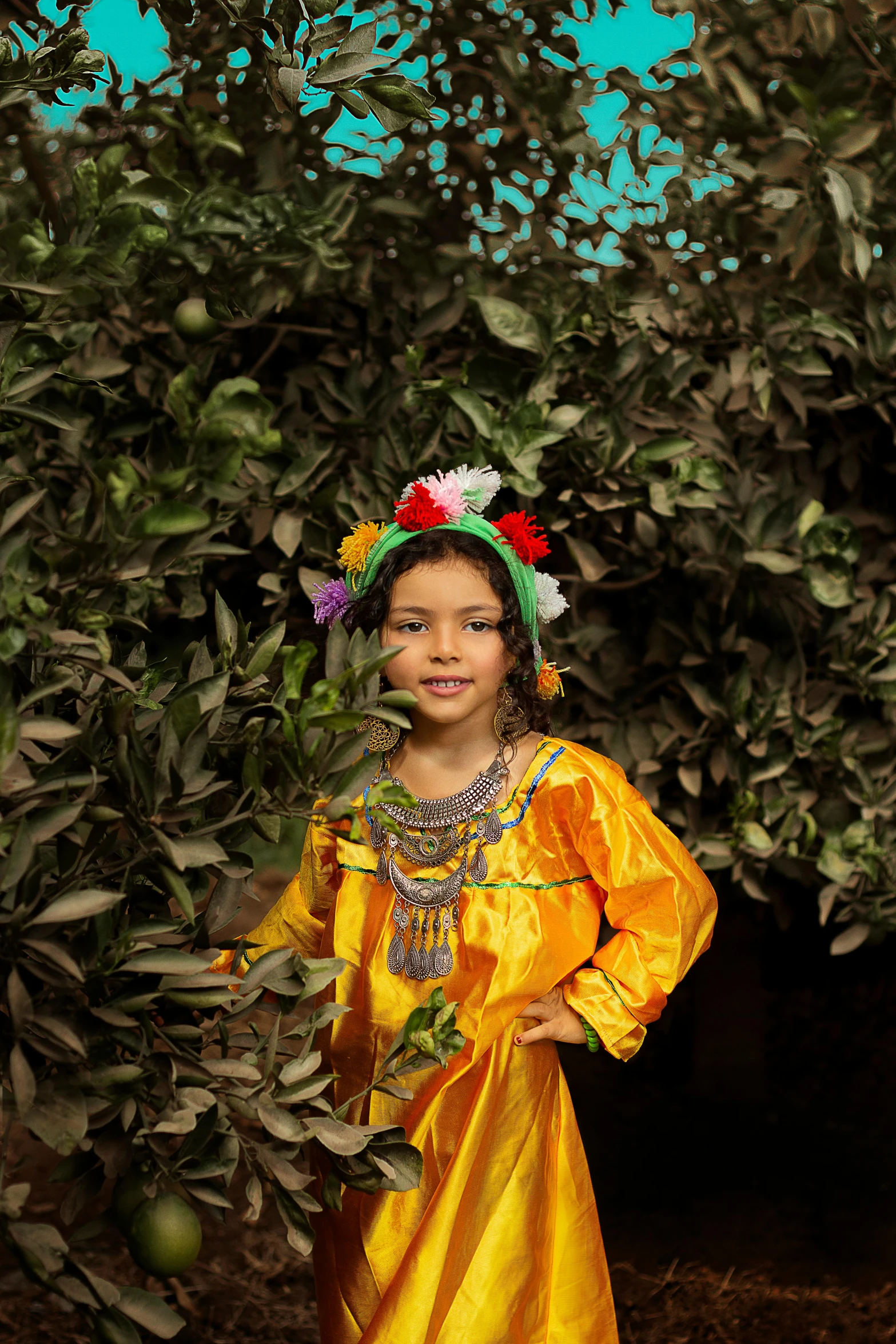 a girl is standing among some leaves