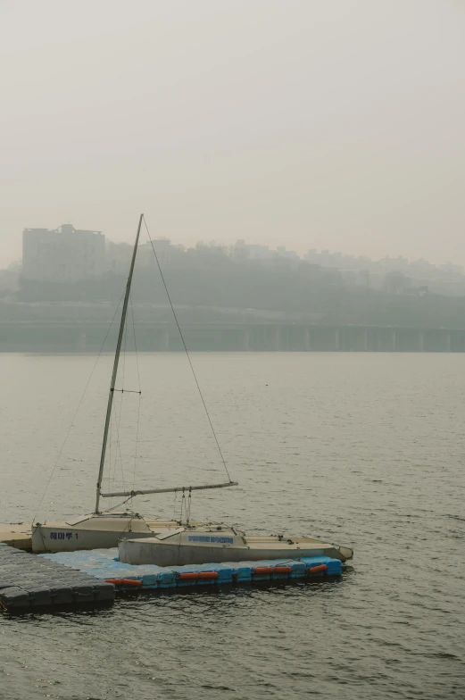 a small boat sits on the edge of the water