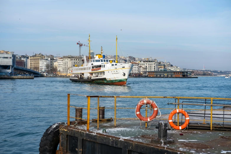 a boat on water with buildings in background