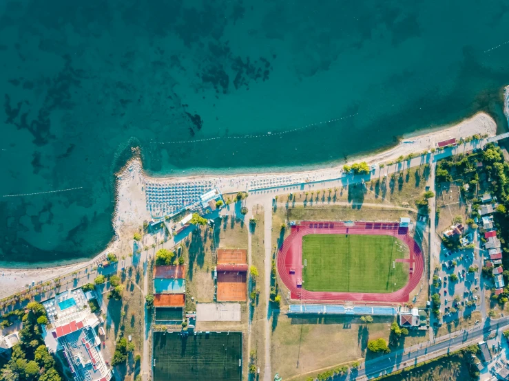 an aerial view of a large field in a city