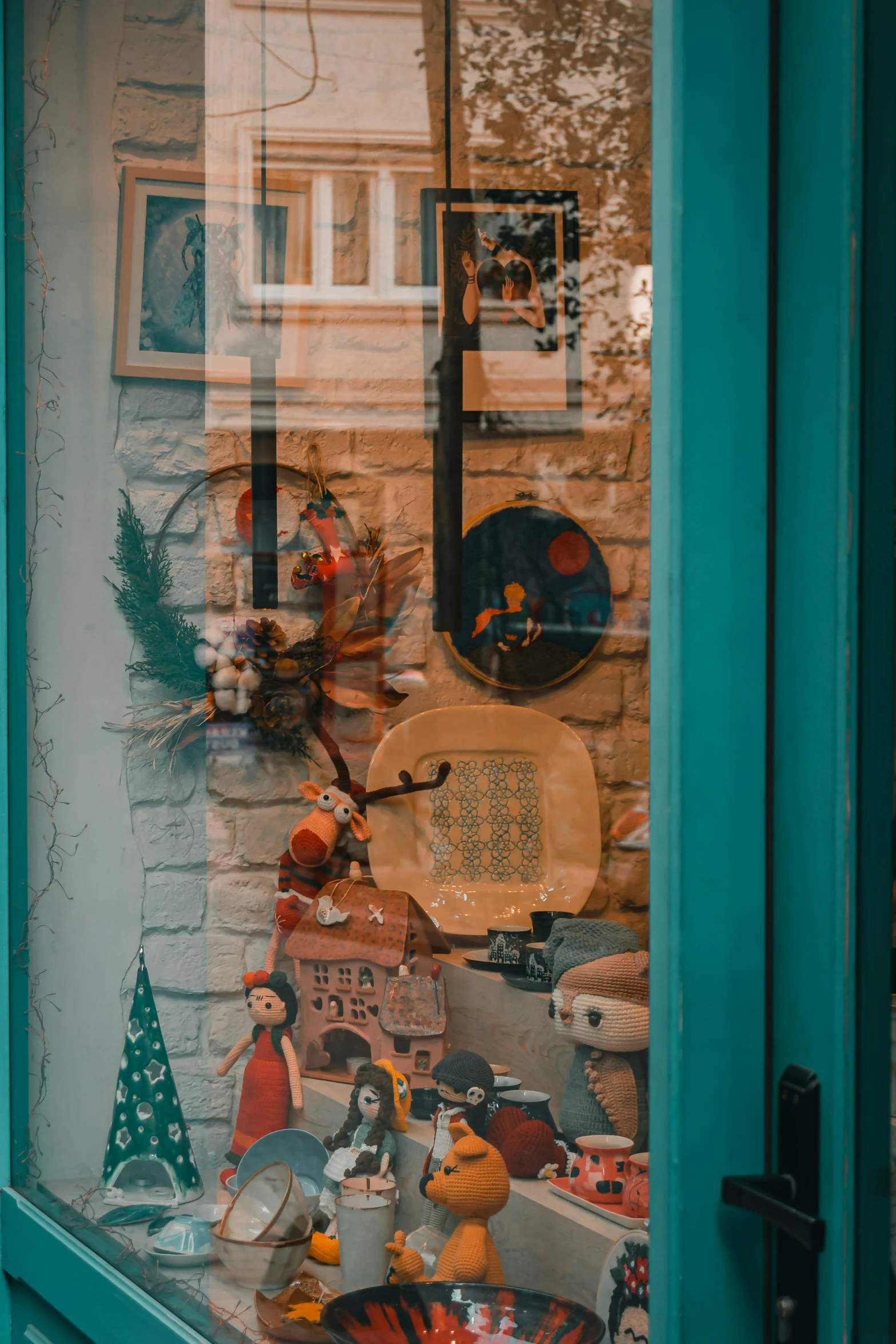 a window display with glass showing things behind it