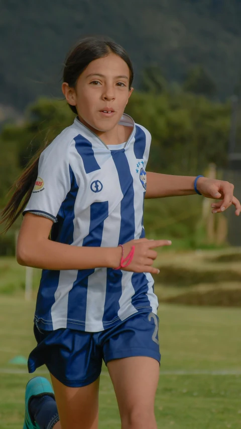 a  prepares to kick the soccer ball