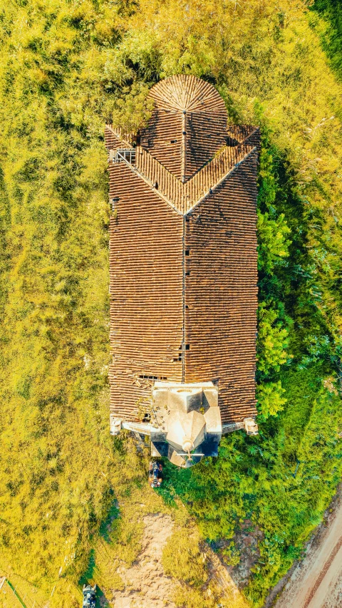 an aerial view of a house surrounded by trees