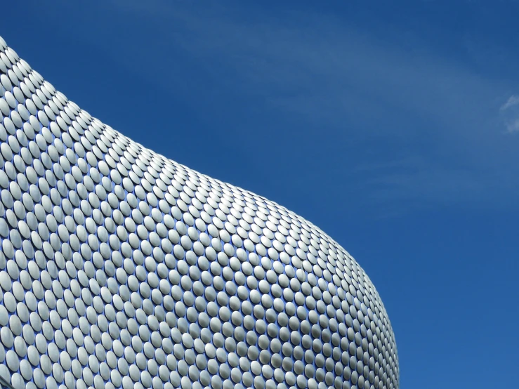 a large gray structure on the side of a building