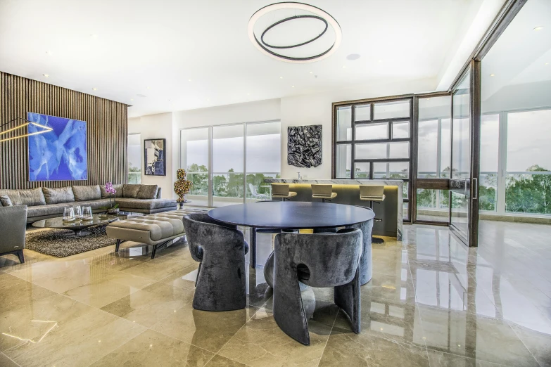 this living room features shiny marble floors and contemporary style furniture