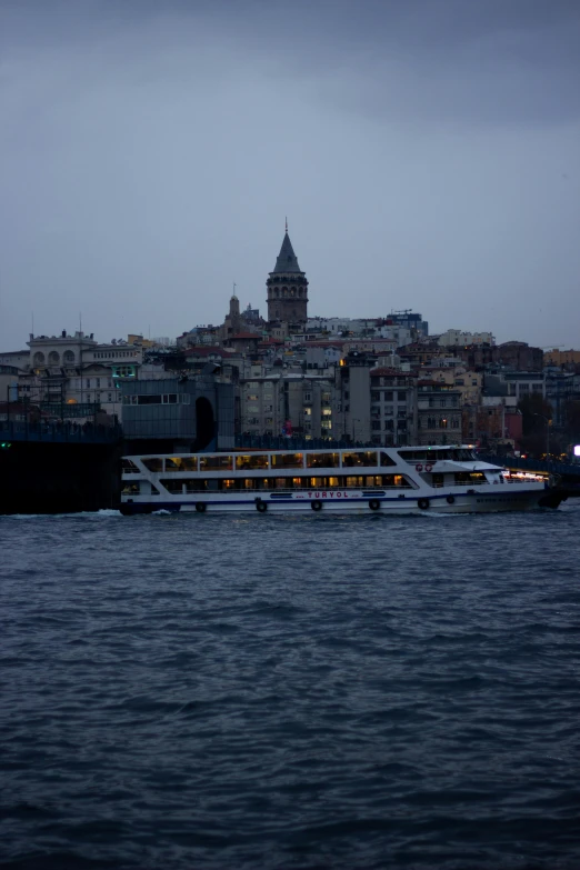 there is a boat floating on the water near some buildings