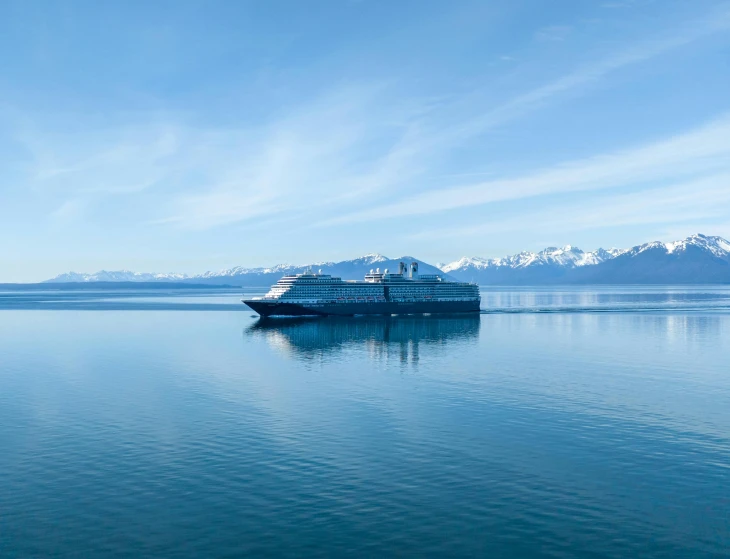 a ship traveling across a large body of water