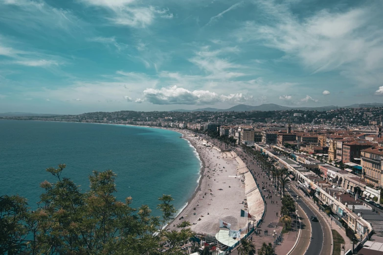 a beautiful blue ocean is seen from the top of a hill