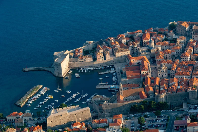 an aerial view of a very small city by the water