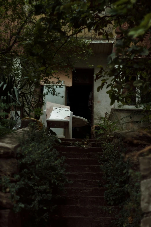 an empty table sitting on top of a set of stairs